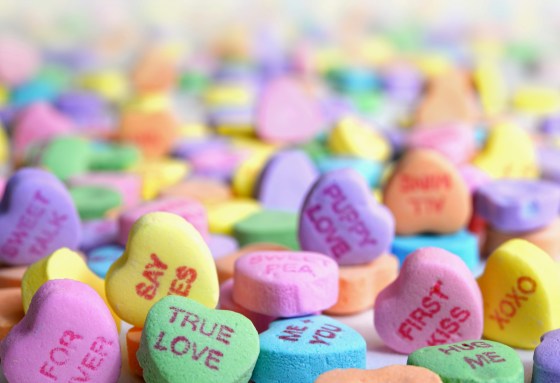 A selection of colourful love heart sweets.